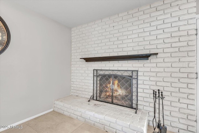 details featuring a fireplace and baseboards