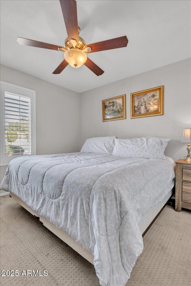 bedroom featuring a ceiling fan and carpet flooring