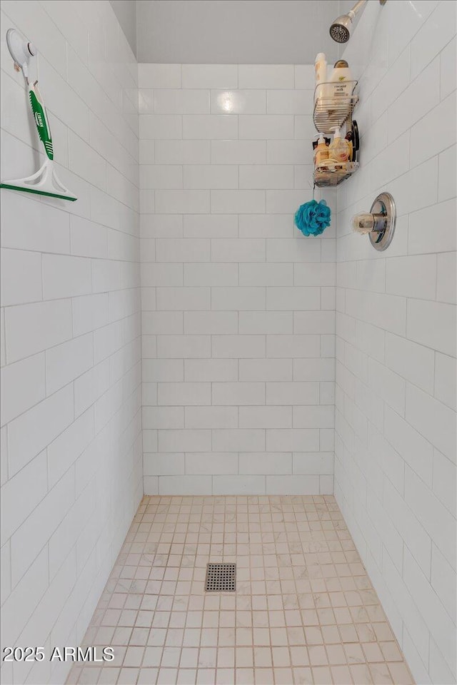 full bathroom featuring visible vents and a tile shower