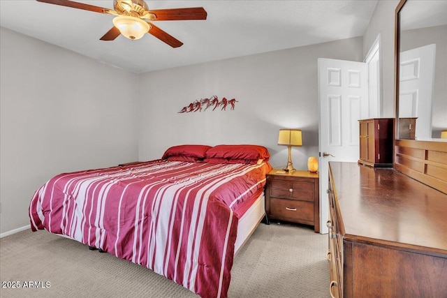 bedroom featuring carpet floors, baseboards, and a ceiling fan