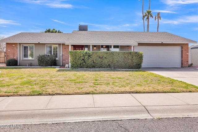 ranch-style home featuring a garage, a shingled roof, brick siding, driveway, and a front lawn