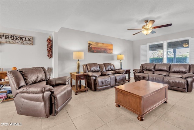 living room with light tile patterned floors and ceiling fan