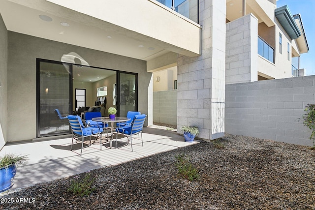 view of patio featuring fence