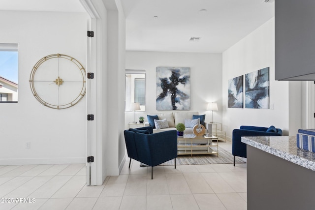 interior space featuring baseboards and visible vents