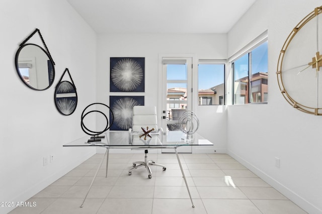 office space featuring baseboards and tile patterned floors