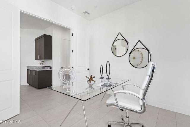 dining room with baseboards and visible vents