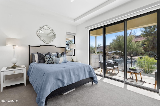 carpeted bedroom featuring access to exterior