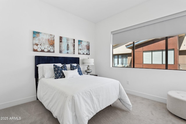bedroom with carpet floors and baseboards