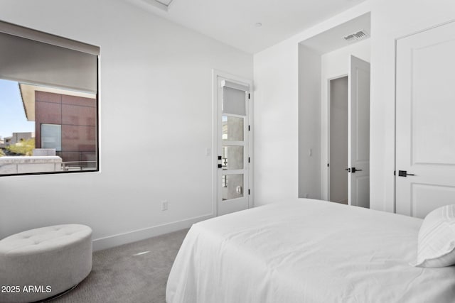 bedroom featuring visible vents, carpet flooring, and baseboards