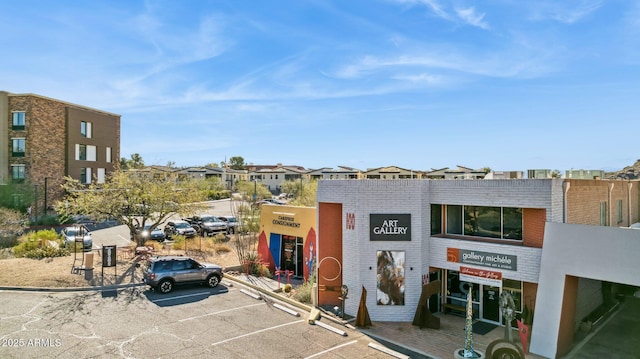 view of building exterior featuring uncovered parking