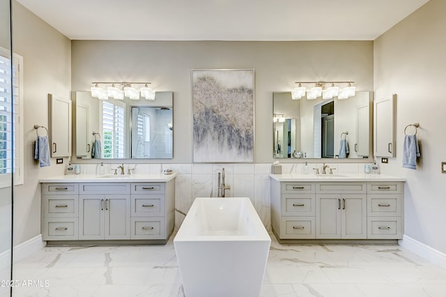 bathroom with vanity and a tub to relax in