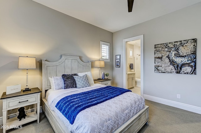 bedroom with ceiling fan, carpet floors, and ensuite bathroom