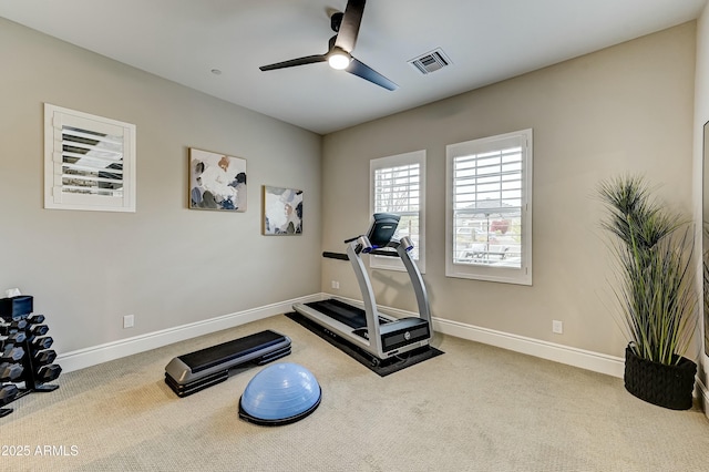 workout area with light colored carpet and ceiling fan