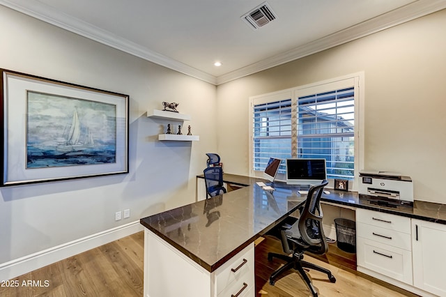 home office with light wood-type flooring and crown molding