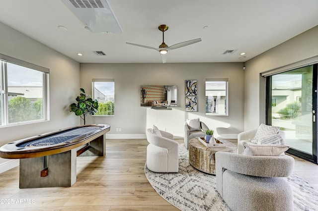 game room with ceiling fan and light hardwood / wood-style floors