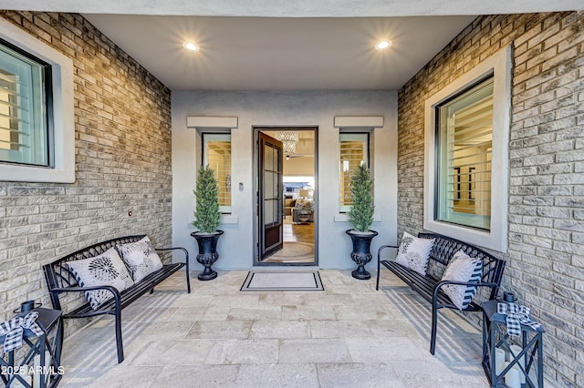 doorway to property with an outdoor hangout area and a patio area