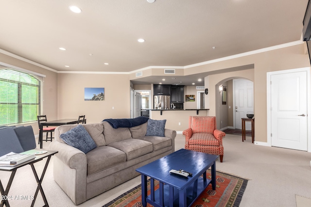 carpeted living room featuring crown molding