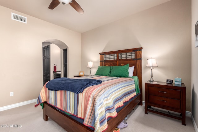 bedroom with ceiling fan and light colored carpet