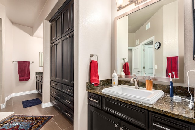 bathroom with vanity and tile patterned floors