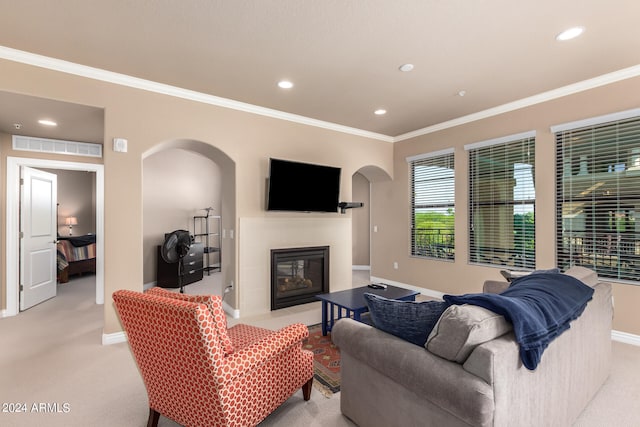 carpeted living room with ornamental molding