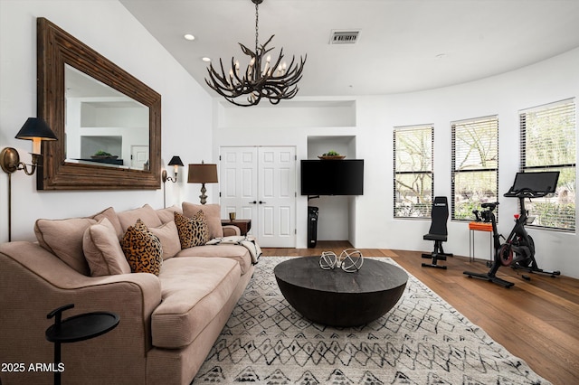 7025 E Ashler Hills Dr, Scottsdale, AZ 85266 - living room featuring a chandelier, wood finished floors, and recessed lighting