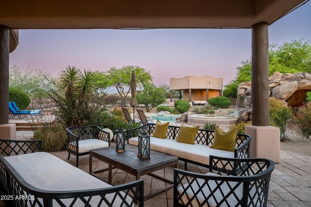 7025 E Ashler Hills Dr, Scottsdale, AZ 85266 - patio terrace at dusk with outdoor lounge area, a patio area, and an outdoor pool