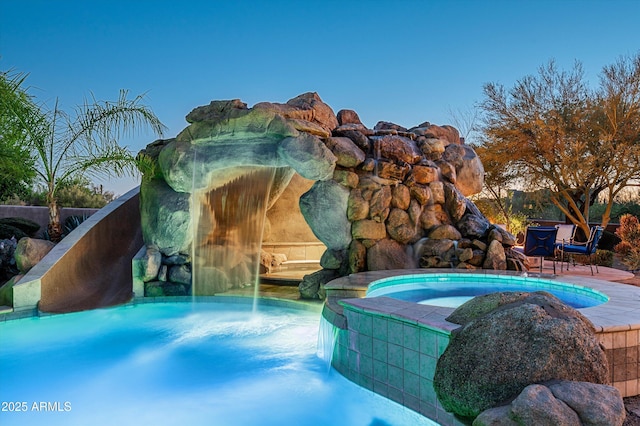 7025 E Ashler Hills Dr, Scottsdale, AZ 85266 - view of pool with a water slide and a pool with connected hot tub