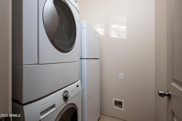 7025 E Ashler Hills Dr, Scottsdale, AZ 85266 - laundry area featuring stacked washer and clothes dryer and light tile patterned floors