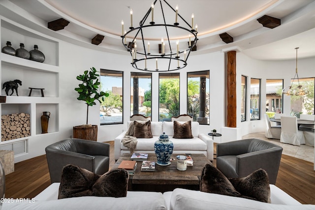 7025 E Ashler Hills Dr, Scottsdale, AZ 85266 - living room with a chandelier, plenty of natural light, built in shelves, and wood finished floors
