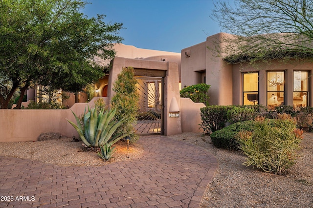 7025 E Ashler Hills Dr, Scottsdale, AZ 85266 - doorway to property featuring a gate and stucco siding