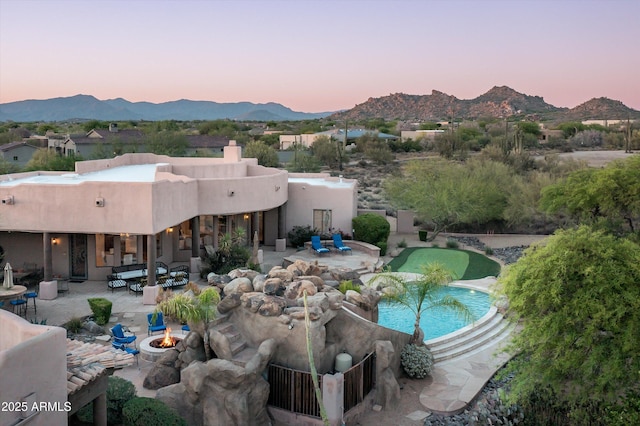 7025 E Ashler Hills Dr, Scottsdale, AZ 85266 - view of swimming pool with a fire pit, a mountain view, and a patio