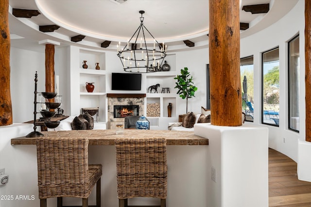 7025 E Ashler Hills Dr, Scottsdale, AZ 85266 - living room featuring wood finished floors, a chandelier, and built in features