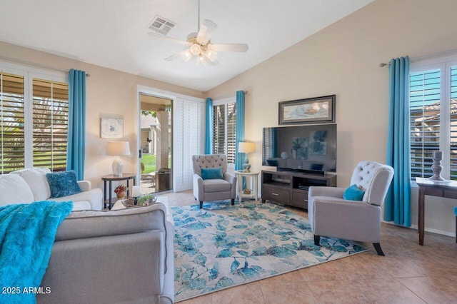 living area with light tile patterned floors, ceiling fan, visible vents, and vaulted ceiling