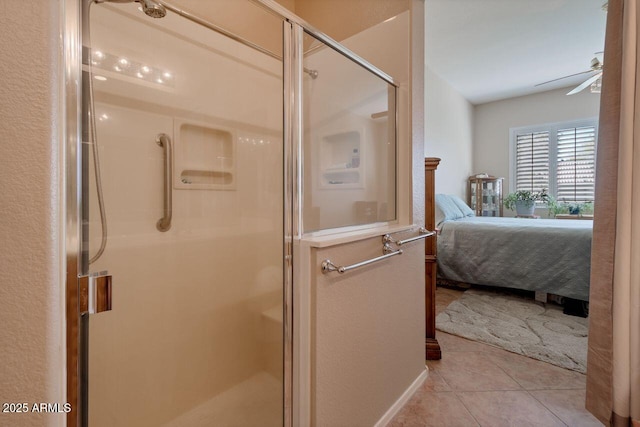 full bath with a stall shower, a ceiling fan, connected bathroom, and tile patterned floors