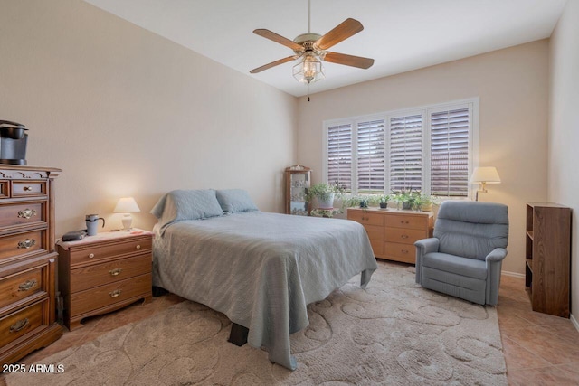 bedroom featuring a ceiling fan and light tile patterned flooring