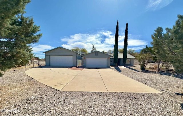 single story home with a detached garage and stucco siding