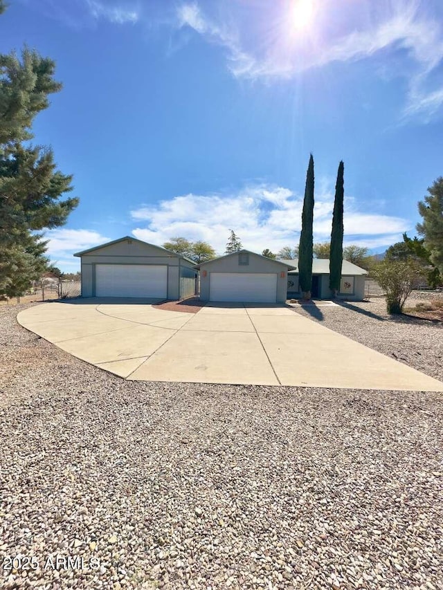 ranch-style home with a garage and stucco siding