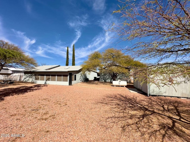 view of side of property with a sunroom