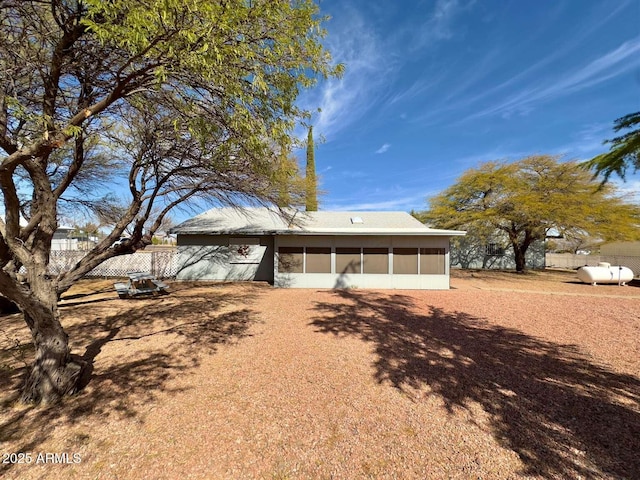 view of front of property with a sunroom