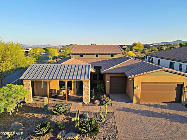 17249 E Fort Verde Rd, Rio Verde, AZ 85263 - ranch-style home featuring an attached garage, a tile roof, stucco siding, and driveway