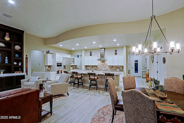17249 E Fort Verde Rd, Rio Verde, AZ 85263 - dining space with a chandelier, light wood-type flooring, and recessed lighting