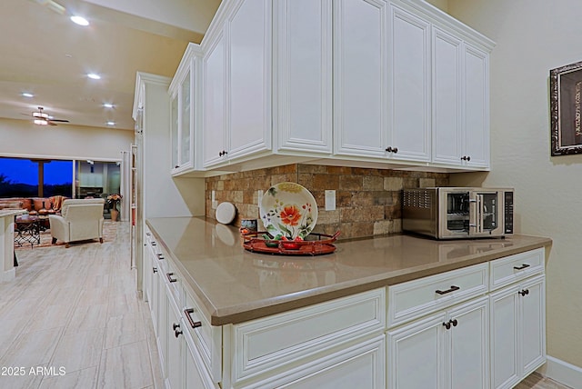 17249 E Fort Verde Rd, Rio Verde, AZ 85263 - kitchen featuring ceiling fan, tasteful backsplash, white cabinets, open floor plan, and recessed lighting