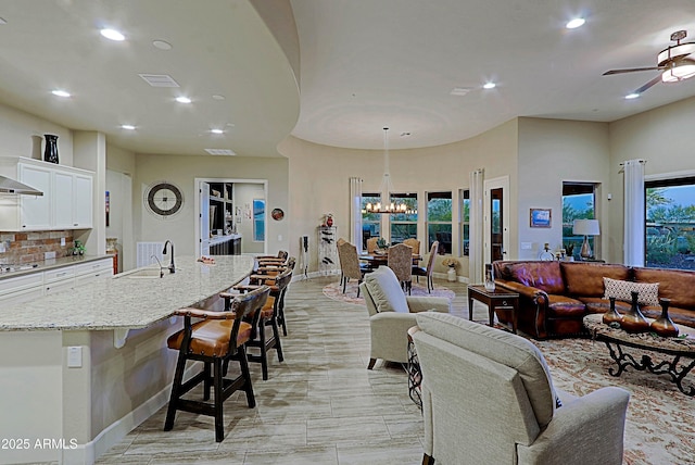 17249 E Fort Verde Rd, Rio Verde, AZ 85263 - living room featuring recessed lighting, a ceiling fan, a chandelier, and baseboards