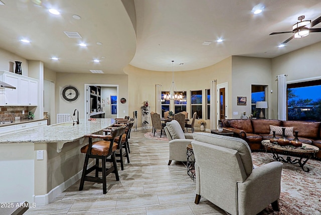 17249 E Fort Verde Rd, Rio Verde, AZ 85263 - living room with recessed lighting, a chandelier, a ceiling fan, and baseboards