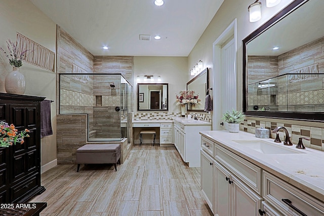 17249 E Fort Verde Rd, Rio Verde, AZ 85263 - bathroom featuring a shower stall, decorative backsplash, two vanities, and recessed lighting