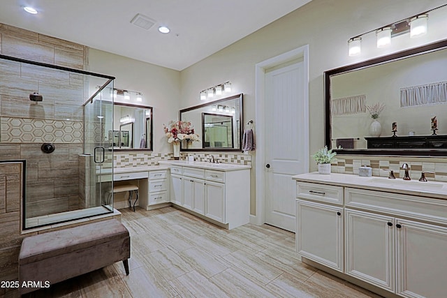 17249 E Fort Verde Rd, Rio Verde, AZ 85263 - bathroom featuring decorative backsplash, a stall shower, two vanities, and recessed lighting