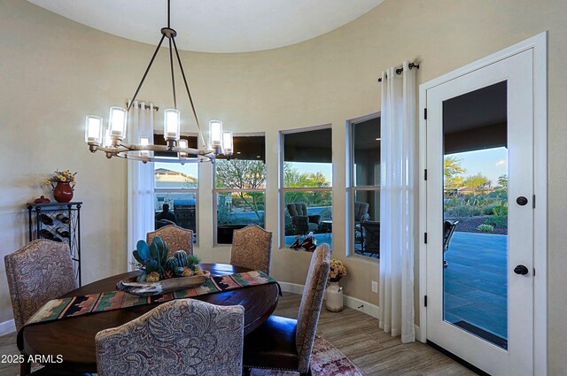 17249 E Fort Verde Rd, Rio Verde, AZ 85263 - dining space with a chandelier, wood finished floors, and baseboards