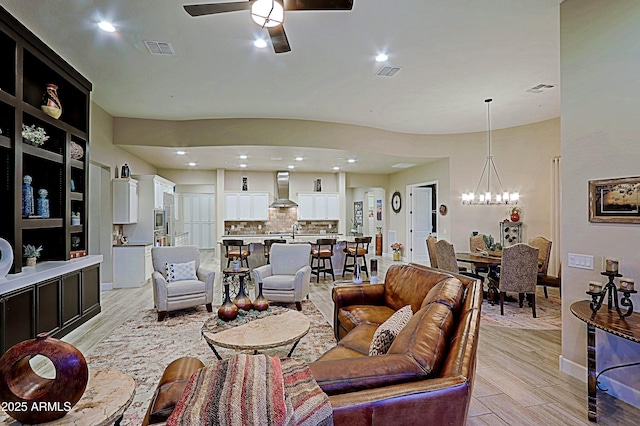 17249 E Fort Verde Rd, Rio Verde, AZ 85263 - living area with a chandelier, light wood-style floors, a ceiling fan, baseboards, and recessed lighting