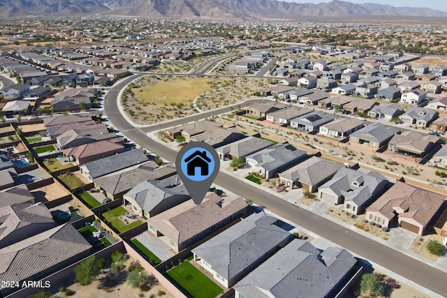 birds eye view of property with a mountain view