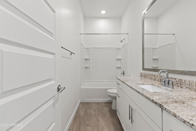 full bathroom featuring hardwood / wood-style floors, vanity, toilet, and shower / bath combination